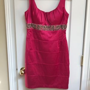 Fuashia Color knee length dress with beaded front.